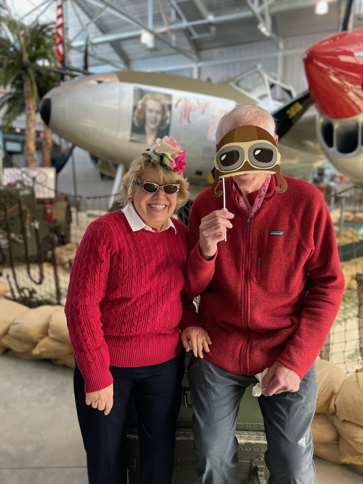 older couple in red sweaters photo op!
